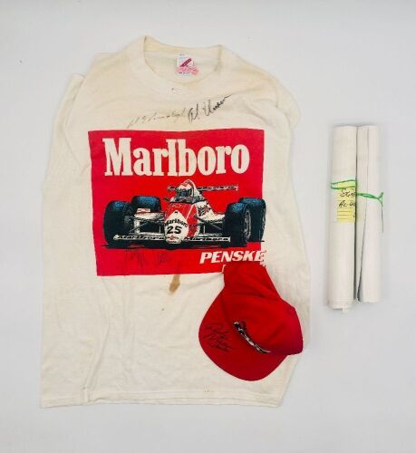 338 · AL UNSER JR: A group of Al Unser Jr. signed items including a t-shirt, a cap and two posters [Location: Sydney]