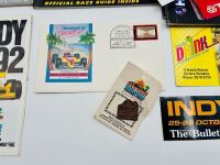 INDY CAR GOLD COAST: Eleven event programs for the Indy Car Gold Coast race together with stickers and a badge [Location: Sydney] - 11