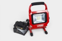 WORKLIGHT: A Workzone adjustable cordless worklight with battery and battery charger, tested in working order.