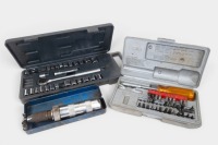TOOLS: A group of various hand tools, including an impact driver, socket set, and screwdriver set