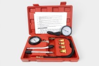 COMPRESSION TESTER: Two compression tester tools, including one complete within a case, including gauge, hose, and connectors