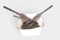 TAP & DIE: A tub of various tap and die tools, including wrenches, dies, and thread taps
