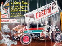 GARRY RUSH: A group of Garry rush items including a signed hat, two signed posters, a 1:24 scale model, two books and two photos [Location: Sydney] - 11