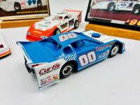 DIRT LATE MODEL: Three 1:24 scale models from the Dirt Late Model series by Action Collectables and ADC together with two framed Clint Smith photos and a novelty licence plate [Location: Sydney] - 3