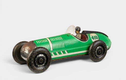 LOUIS MARX & CO: A circa 1930s Louis Marx & Co (UK) tinplate clockwork race car with driver, 29cm long
