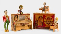L'IL ABNER DOGPATCH BAND: A circa 1945 Unique Art Manufacturing Co (USA) clockwork tinplate 'L'il Abner & his Dogpatch Band' set in original box, features four moving figures attached to piano, 16.5cm wide, 14cm high