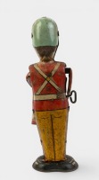 DRUMMER BOY: A circa 1930s / 1940s Louis Marx & Co tinplate clockwork 'George the Drummer Boy' toy, stands 23cm high - 2
