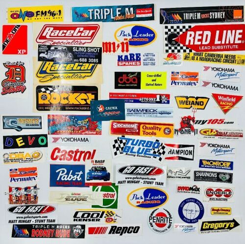AUTOMOTIVE STICKERS: A large group of stickers, mostly automotive [Location: Sydney]