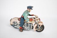 MOTORCYCLE: A large Modern Toys (Japan) tinplate, battery operated policeman on motorcycle toy, 29cm long, 21cm high