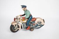 MOTORCYCLE: A large Modern Toys (Japan) tinplate, battery operated policeman on motorcycle toy, 29cm long, 21cm high - 2