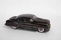 MINISTER DELUXE: A c1950s Minister Deluxe, made by Amar (India) tinplate friction Pontiac Chieftain, 25cm long - 2