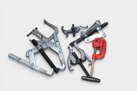 GEAR PULLERS: A tub of assorted gear puller tools of differing sizes & styles