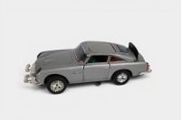 ASTON MARTIN: A c1960s United (Japan) tinplate friction Multi Action 711 Aston Martin Secret Ejector car toy (#51262), 28cm long, in original box - 2