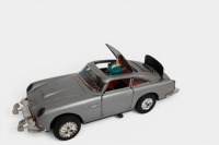 ASTON MARTIN: A c1960s United (Japan) tinplate friction Multi Action 711 Aston Martin Secret Ejector car toy (#51262), 28cm long, in original box - 3