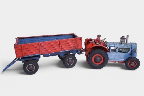 TRACTOR: A c1950s Gama (US Zone Germany) tinplate battery operated tractor & trailer toy, 40cm long