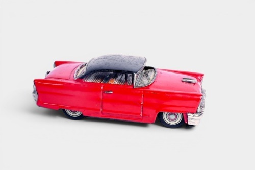 ICHIKO: A c1950s Ichiko (Japan) tinplate friction Lincoln Premiere toy car, 19cm long