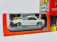 SLOT CARS: Three 1:32 scale slot cars including a Nissan Skyline GTR model kit by Slot.it, a BMW E30 M3 by Matchbox/SCX and a Toyota GT86 by Policar, all in original packaging [Location: Sydney] - 2