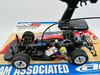 DIRT LATE MODEL: A 1:18 scale RTR electric 4WD RC car by Team Associated of a dirt late model race car with original packaging [Location: Sydney] - 4