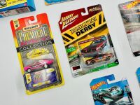 MODEL CARS: A group of 1:64 scale model cars by Johnny Lightning, Hot Wheels, Jada and Matchbox [Location: Sydney] - 2