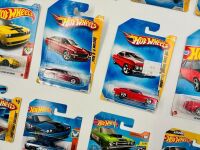 MUSCLE CARS: A group of 23 1:64 scale Hot Wheels muscle car models with a Dodge Challenger sign [Location: Sydney] - 3