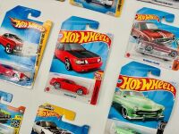 MUSCLE CARS: A group of 23 1:64 scale Hot Wheels muscle car models with a Dodge Challenger sign [Location: Sydney] - 4