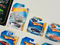 MUSCLE CARS: A group of 23 1:64 scale Hot Wheels muscle car models with a Dodge Challenger sign [Location: Sydney] - 6
