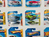 MUSCLE CARS: A group of 23 1:64 scale Hot Wheels muscle car models with a Dodge Challenger sign [Location: Sydney] - 7
