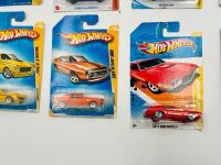 MUSCLE CARS: A group of 23 1:64 scale Hot Wheels muscle car models with a Dodge Challenger sign [Location: Sydney] - 11