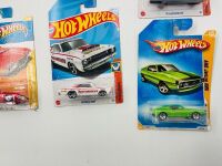 MUSCLE CARS: A group of 23 1:64 scale Hot Wheels muscle car models with a Dodge Challenger sign [Location: Sydney] - 12