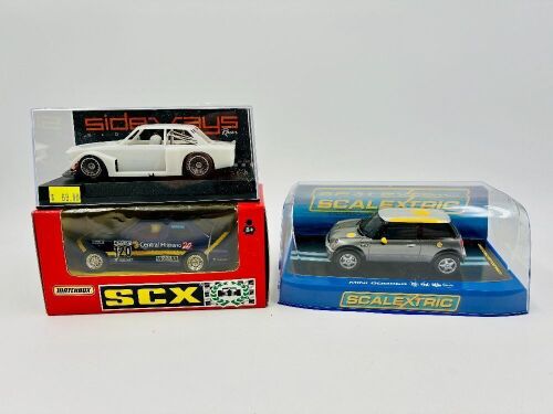 SLOT CARS: Three 1:32 scale slot cars including a BMW M3 by SCX/Matchbox, a Mini Cooper by Scalextric and a BMW 32 Gr.5 kit by Sideways [Location: Sydney]