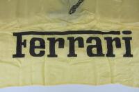 FERRARI: Two Ferrari items including a large Ferrari silk flag and a prancing horse wheel knock off. - 2