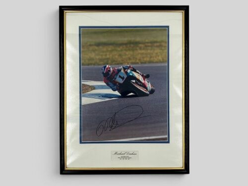 MICK DOOHAN: A framed signed original photograph of Mick Doohan by motorsport photographer John Morris, together with a team cap. [Location: Sydney]