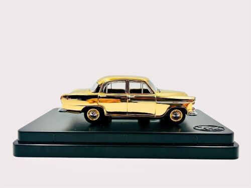 303 · HOLDEN FE: A 1:43 scale model by Trax of the 1956-1958 Holden FE painted in gold to celebrate the 50th Anniversary of the FE, together with original packaging [Location: Sydney]
