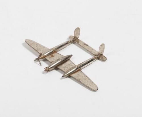 TRENCH ART: A 1940s metal trench art aeroplane with incorporated bullet casings, 21cm wide