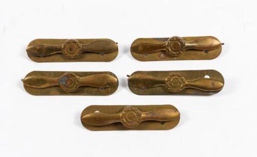 RAAF: Five brass RAAF WWII propeller uniform badges, 6cm long