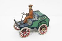 LEHMANN: A circa early 1900s Lehmann (Germany) clockwork tin toy, features a uniformed driver atop early veteran car marked 'OHO' - 2