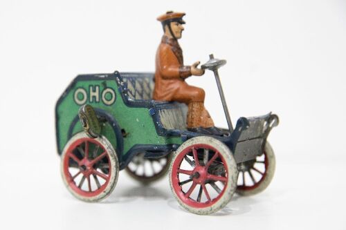 LEHMANN: A circa early 1900s Lehmann (Germany) clockwork tin toy, features a uniformed driver atop early veteran car marked 'OHO'