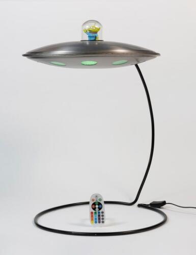SPACESHIP: A novelty lamp in the form of an alien spaceship, with adjustable multi-colour lights, 63cm high x 43cm wide (base) (ship 45cm diameter).