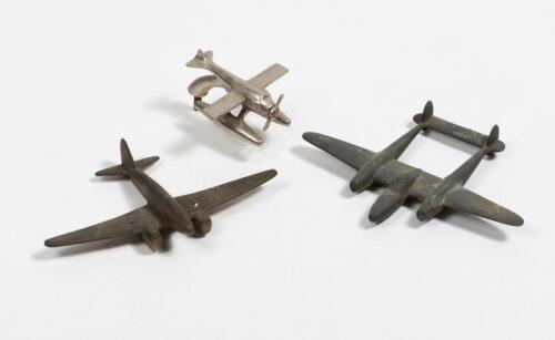 SCHEIDER TROPHY: A small metal mascot of an amphibious aircraft in the Scheider Trophy style and two others