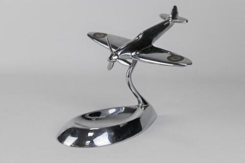 SPITFIRE: A c1940s chromed metal desk piece featuring a MK-1 Supermarine Spitfire in the dive position (14.5cm high x 17cm long)