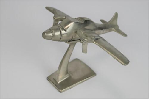 DESK PIECE: A modern decorative cast metal model of a stylised twin prop airplane (13cm high&nbsp;x&nbsp;19cm long)