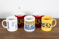 FERRARI / MICHELIN: A group of five coffee mugs, includes three Ferrari mugs and two Michelin mugs