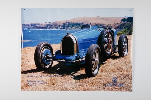 BUGATTI: A poster promoting the June 1990 Melbourne Christie's Important Collector's Motor Cars Auction featuring Bugatti Type 35, 57cm high, 76cm wide