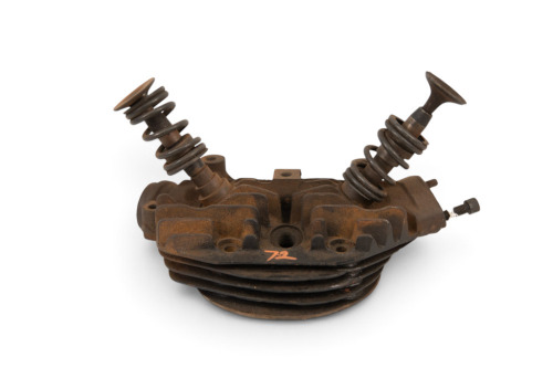 CYLINDER HEAD: A c1930 vintage cylinder head with spare valve guides [Location: Melbourne]