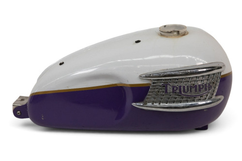 TRIUMPH: A Triumph fuel tank, thought to suit an early unit construction model, with harmonica badges [Location: Melbourne]