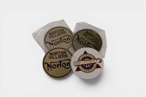 NORTON: A set of three new metal Norton Commando Fastback badges, two for tank, one for tail piece [Location: Melbourne]