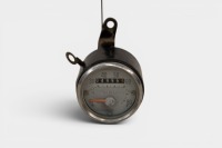 SMITHS: A Smiths 'grey faced' 80 MPH speedometer with counter, marked 'SSM 2001/02 1600', two inch diameter [Location: Melbourne]