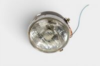 HEADLIGHT: A NOS headlight, complete, lens diameter 18cm [Location: Melbourne]