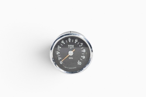 SMITHS: A Smiths 'black face' RPM x 1000, 4:1 drive ratio tachometer gauge, lens width 7.5cm [Location: Melbourne]