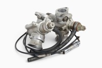 AMAL CARBS: A pair of Amal TT carburetors with cables, stamped '10TT9', bore width 30mm [Location: Melbourne]